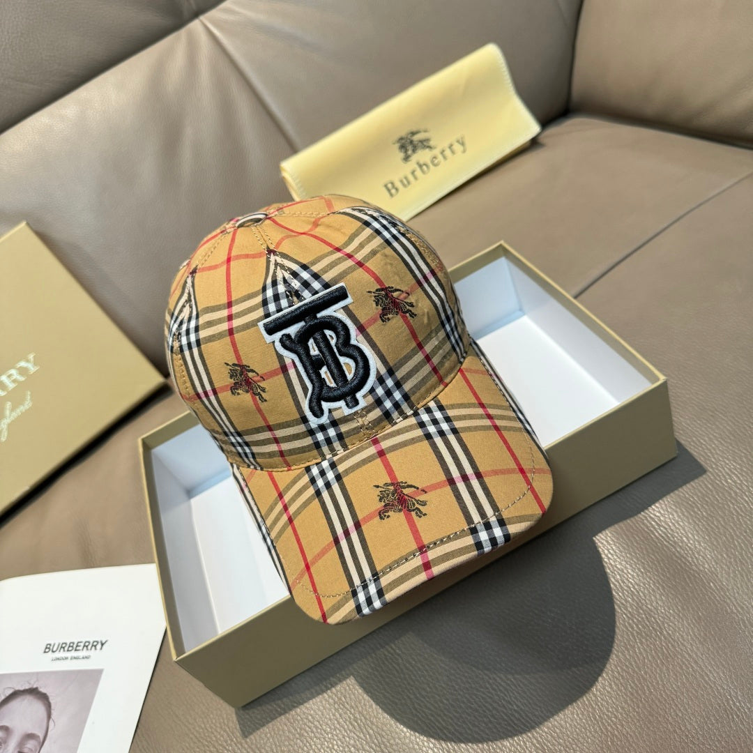 Plaid baseball cap in tan, red, black, and white with embroidered monogram logo