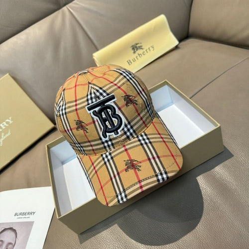 Plaid baseball cap in tan, red, black, and white with embroidered monogram logo