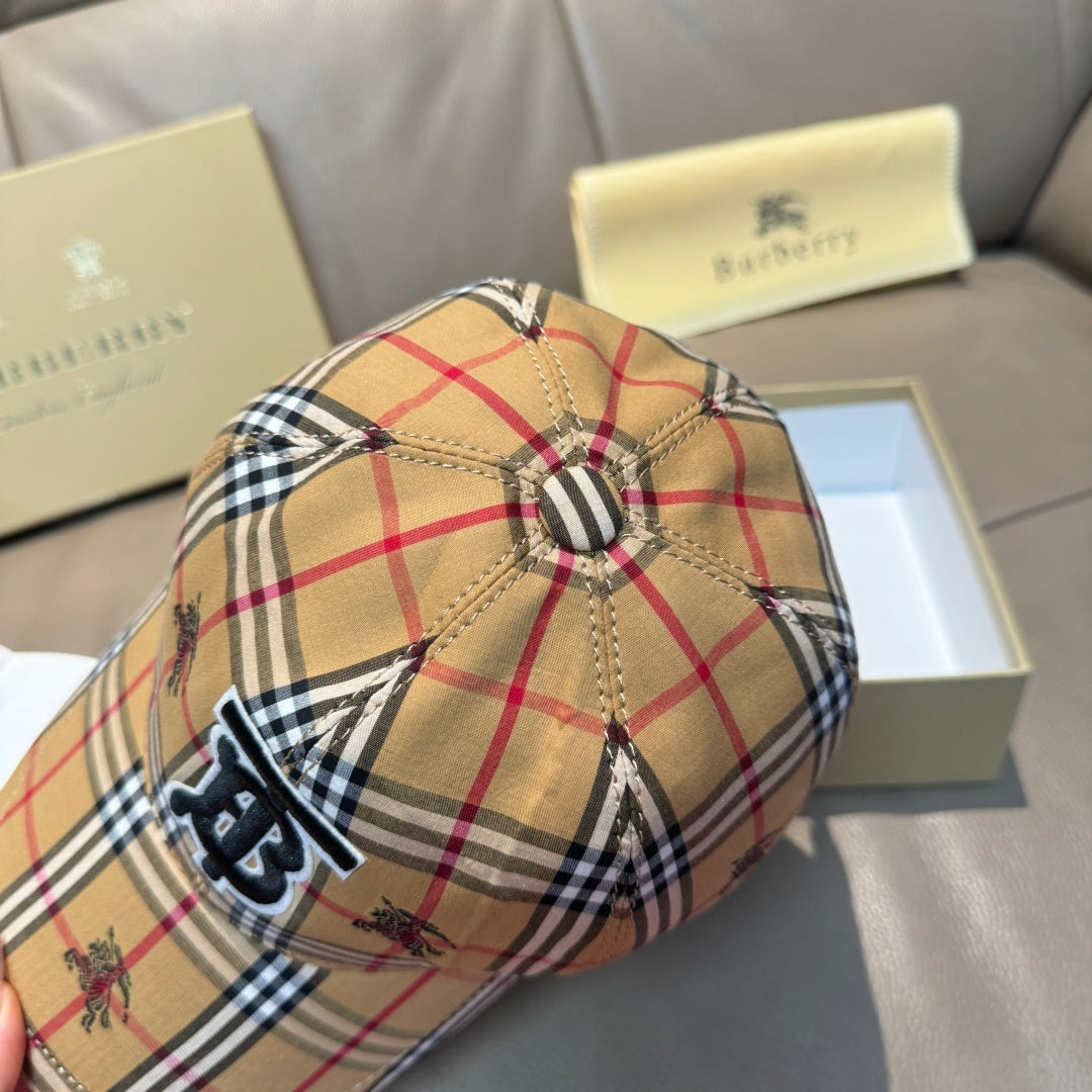 Plaid baseball cap side view with stitched seams and embroidered monogram logo