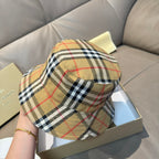 Plaid bucket hat, reverse side with beige black red check panels.