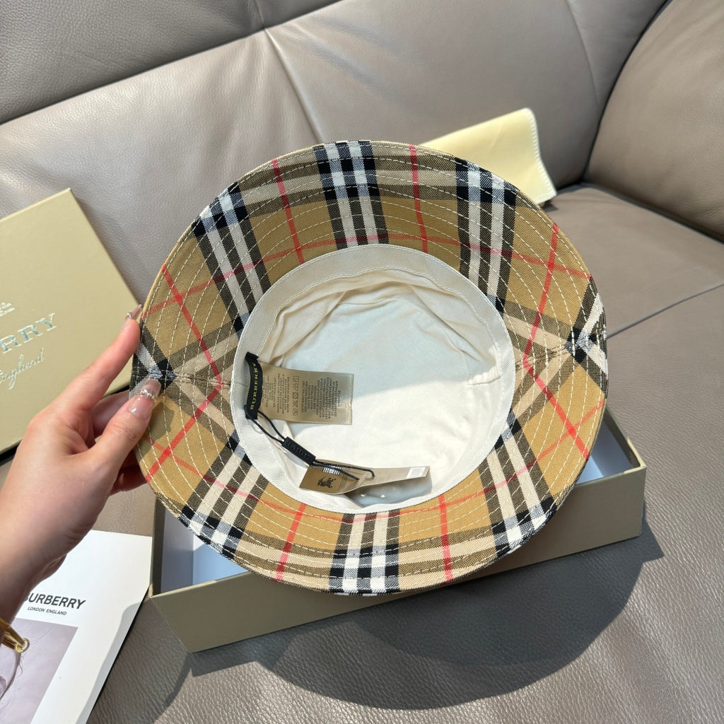 Plaid bucket hat interior with cream lining and beige black red check brim.