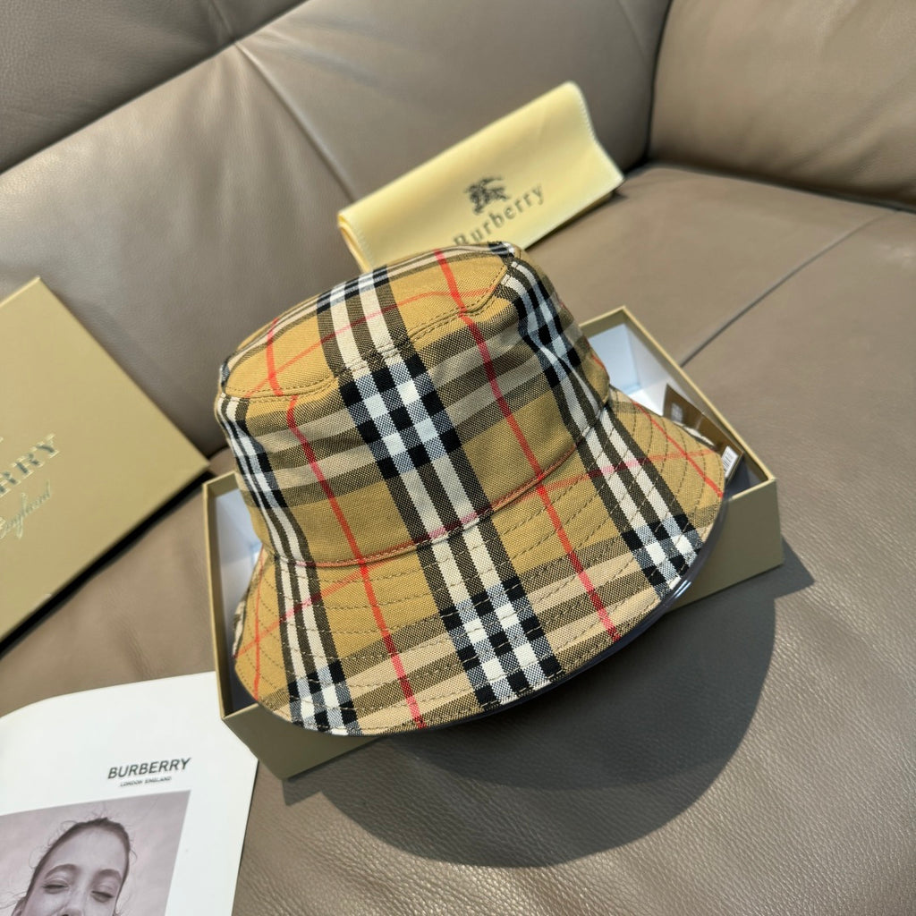 Plaid bucket hat with wide brim, beige black and red check pattern.