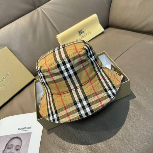Plaid bucket hat with wide brim, beige black and red check pattern.