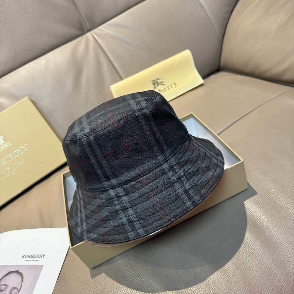 Burberry plaid bucket hat in dark navy with red and gray tartan lines, curved brim