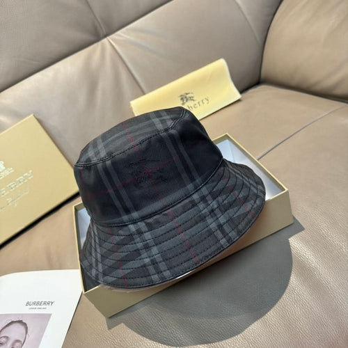Burberry plaid bucket hat in dark navy with red and gray tartan lines, curved brim
