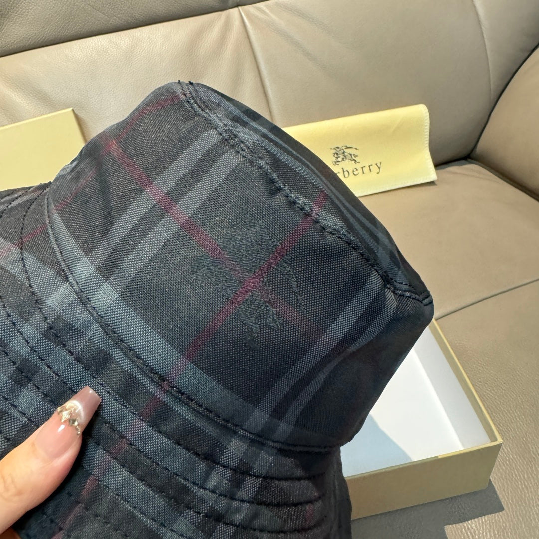 Burberry dark navy plaid bucket hat close-up of brim seam and tartan pattern