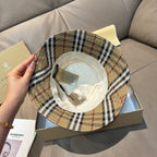 Burberry plaid bucket hat with beige crown and black/red inner label detail