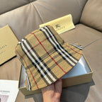 Burberry plaid bucket hat in beige with black and red stripes, front view