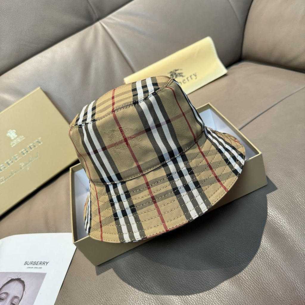 Burberry plaid bucket hat in beige with black and red stripes, stitched brim