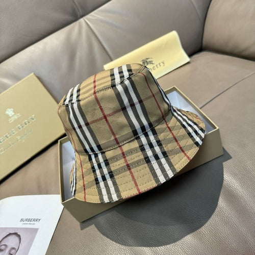 Burberry plaid bucket hat in beige with black and red stripes, stitched brim