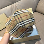 Burberry plaid bucket hat, side profile with beige, black, and red stripe pattern