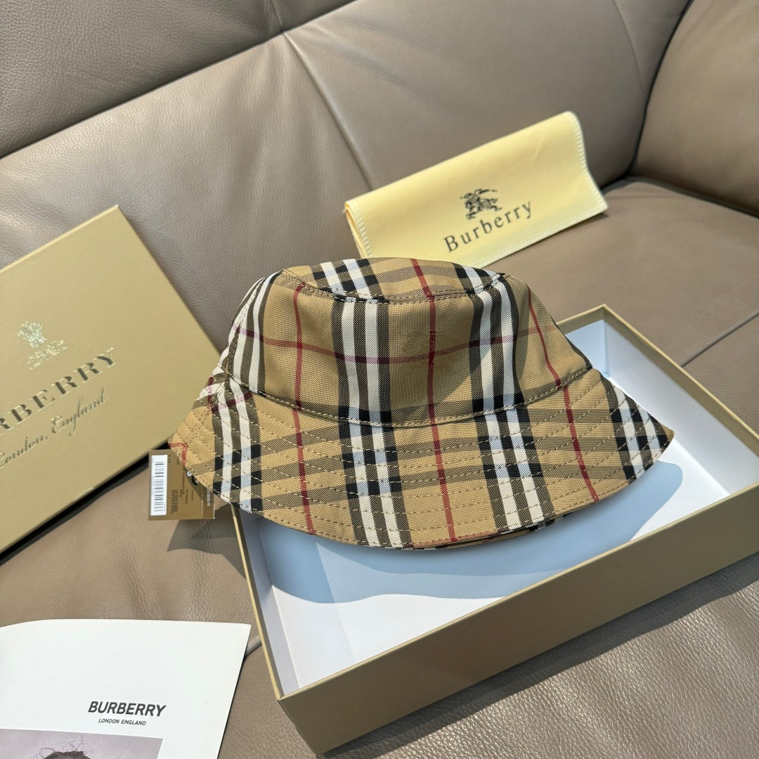 Burberry plaid bucket hat on box, beige with black and red stripes