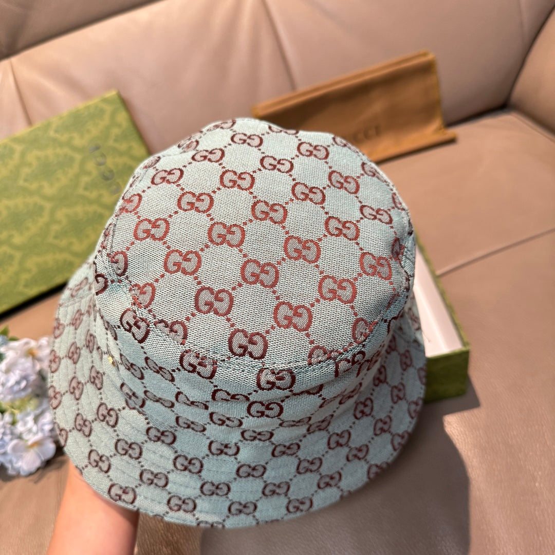 Gucci bucket hat in light blue with red GG monogram pattern, back view