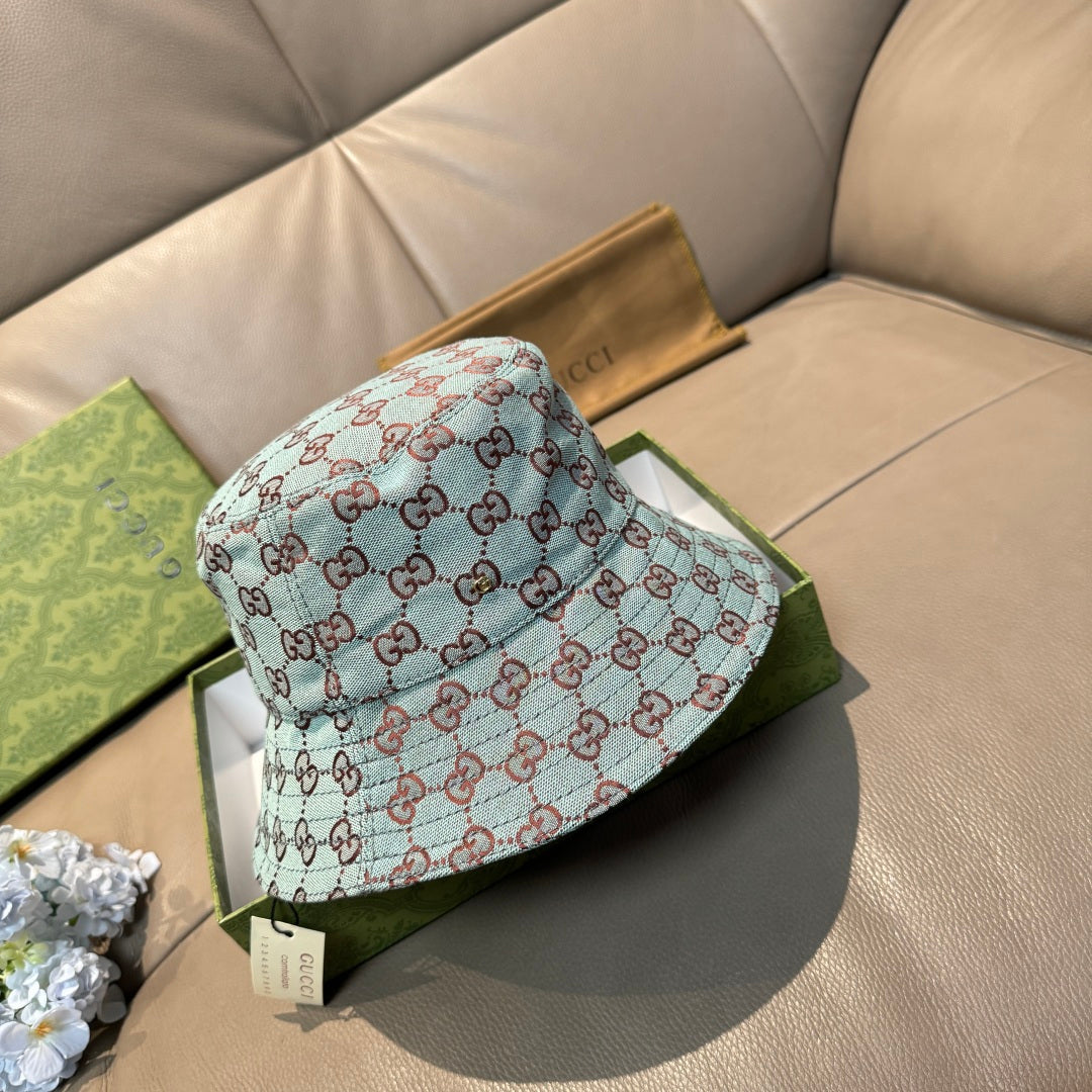 Gucci bucket hat in light blue with red GG monogram pattern, side view