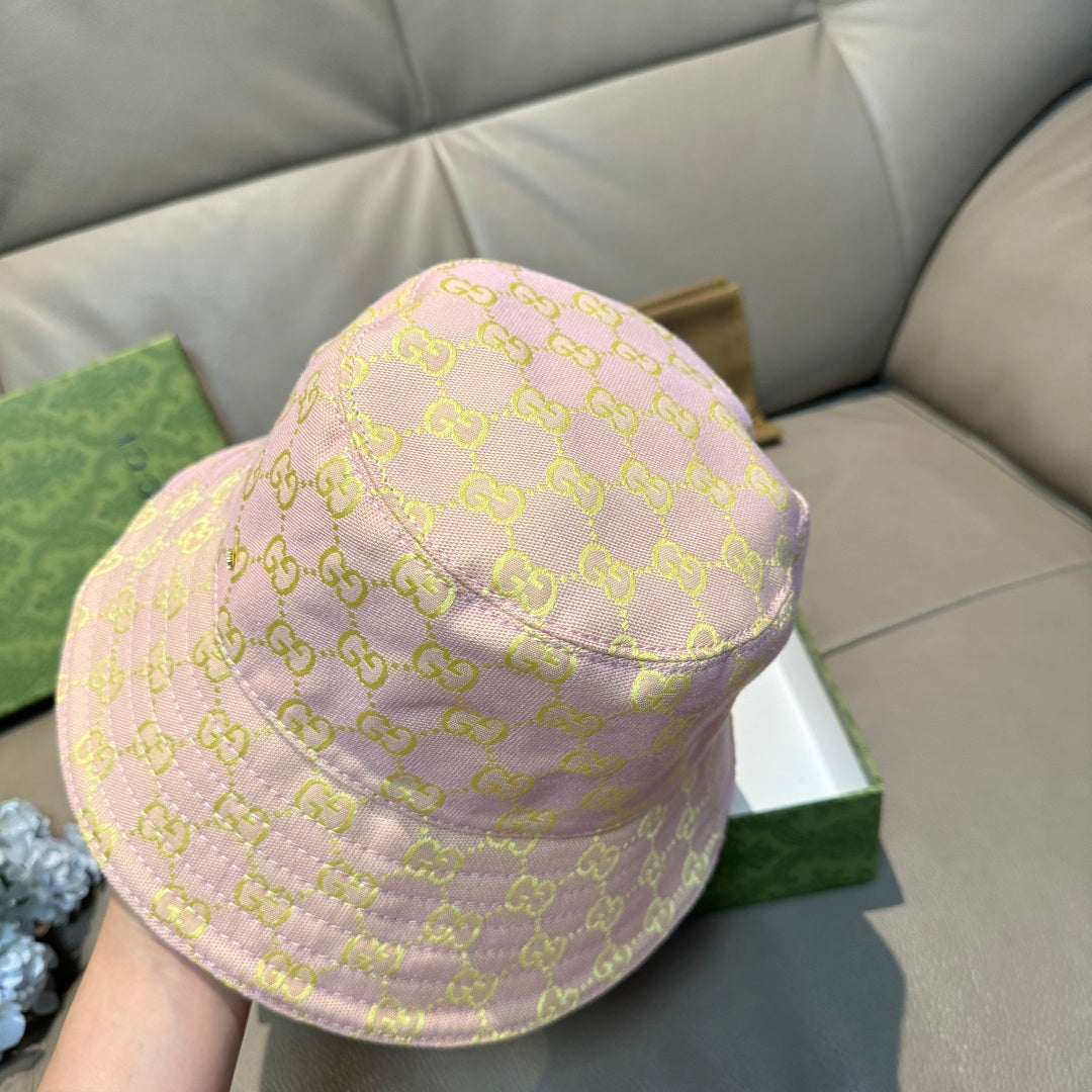 Gucci bucket hat profile, light pink with repeating green GG pattern