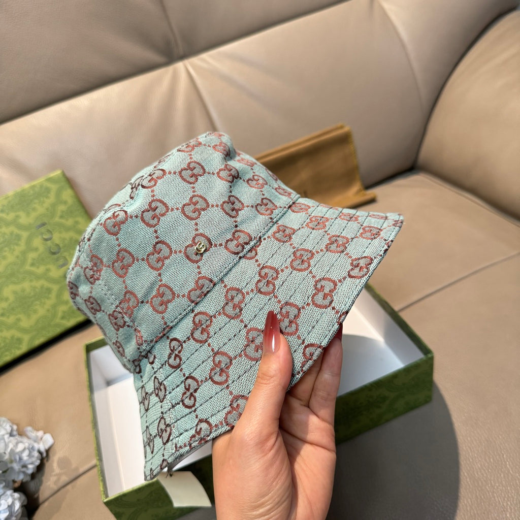 Gucci bucket hat in light blue with red GG monogram pattern, front close view