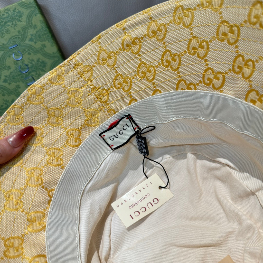 Gucci bucket hat interior with white lining and Gucci logo tags