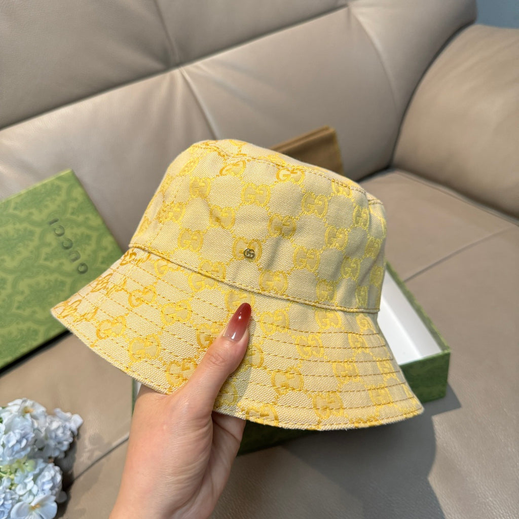 Gucci yellow GG monogram bucket hat with front flap and metal logo rivet