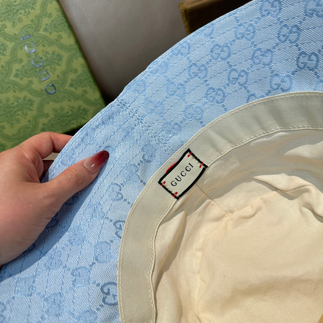 Gucci GG monogram light blue bucket cap with inner fabric label on cream band