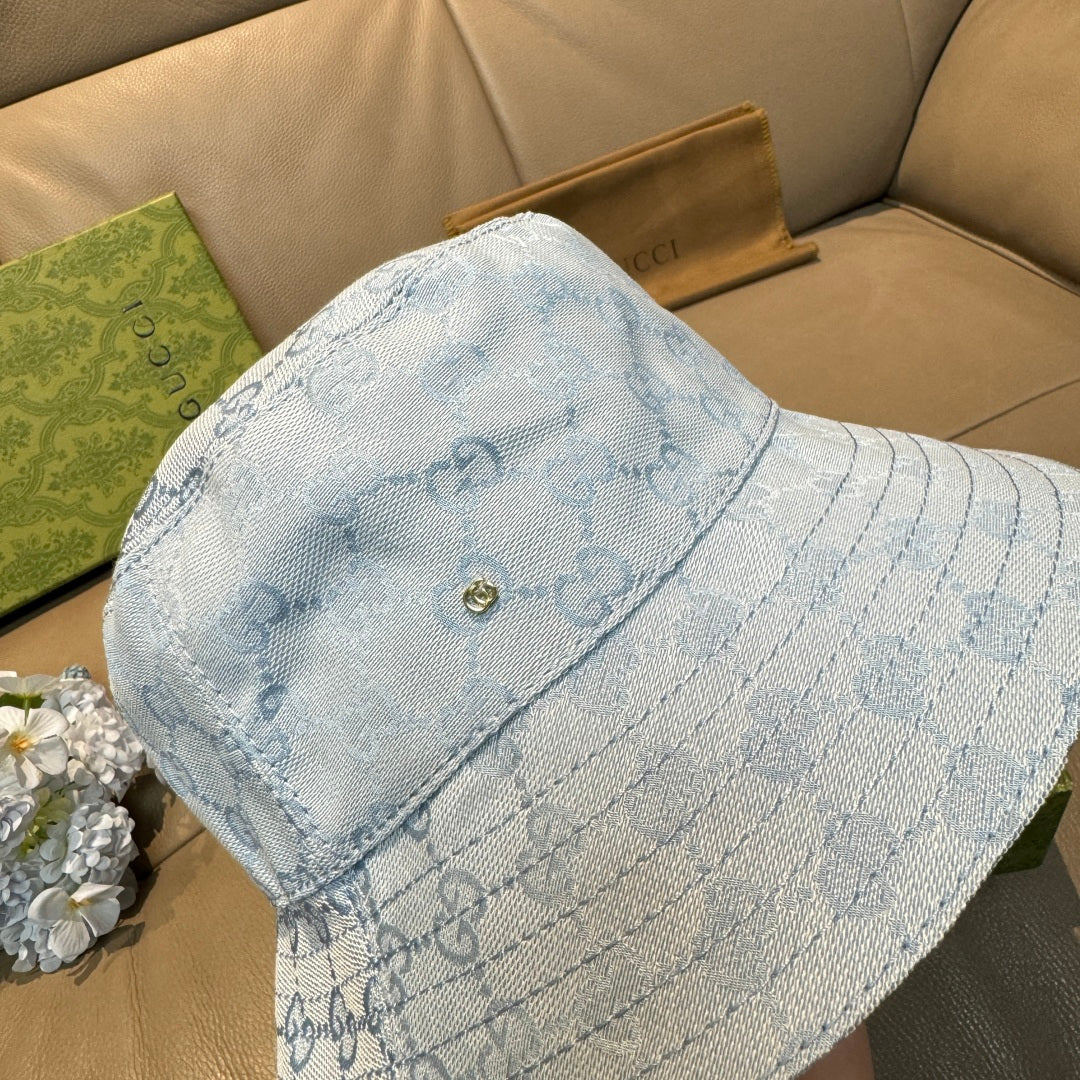 Gucci GG monogram light blue bucket cap, side view with stitched band and metal logo button