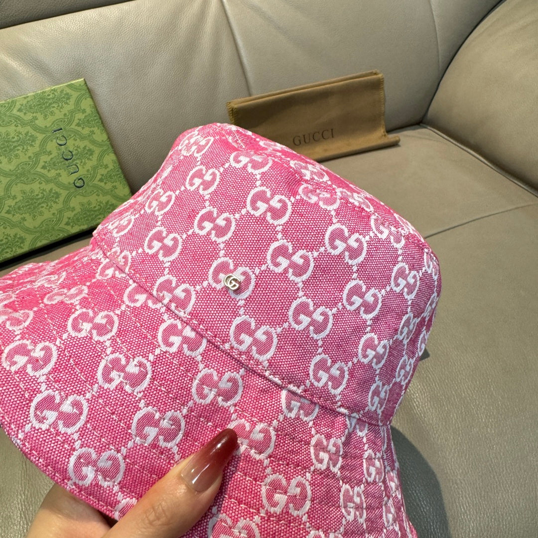 Pink bucket hat with white GG monogram pattern, textured fabric detail
