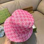 Pink bucket cap with white GG monogram pattern, back view
