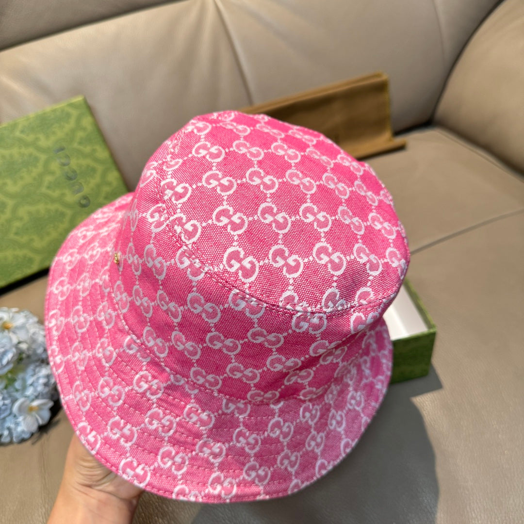 Pink bucket cap with white GG monogram pattern, back view