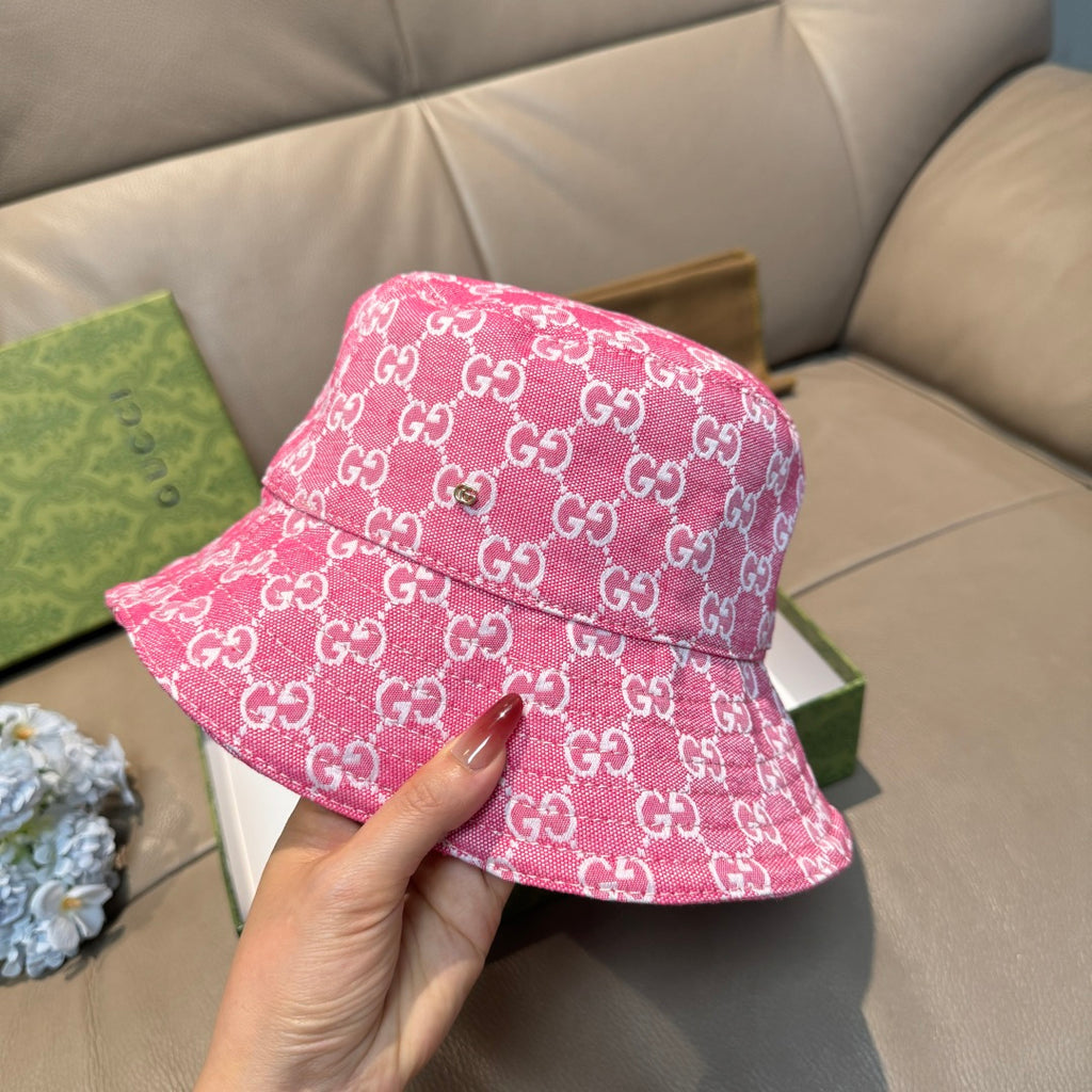 Pink bucket cap with white GG monogram pattern, close side view