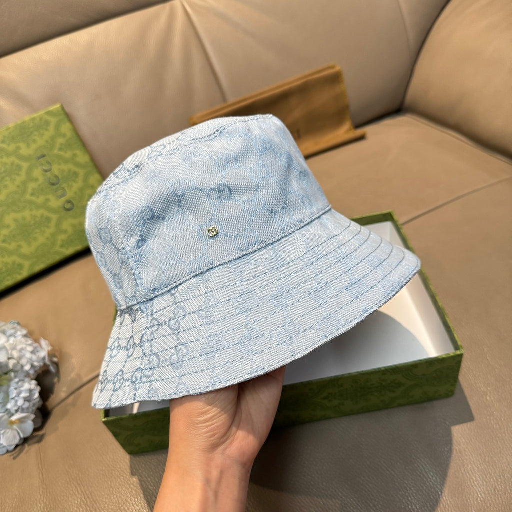 Gucci GG monogram light blue bucket cap with front button detail and stitched panels