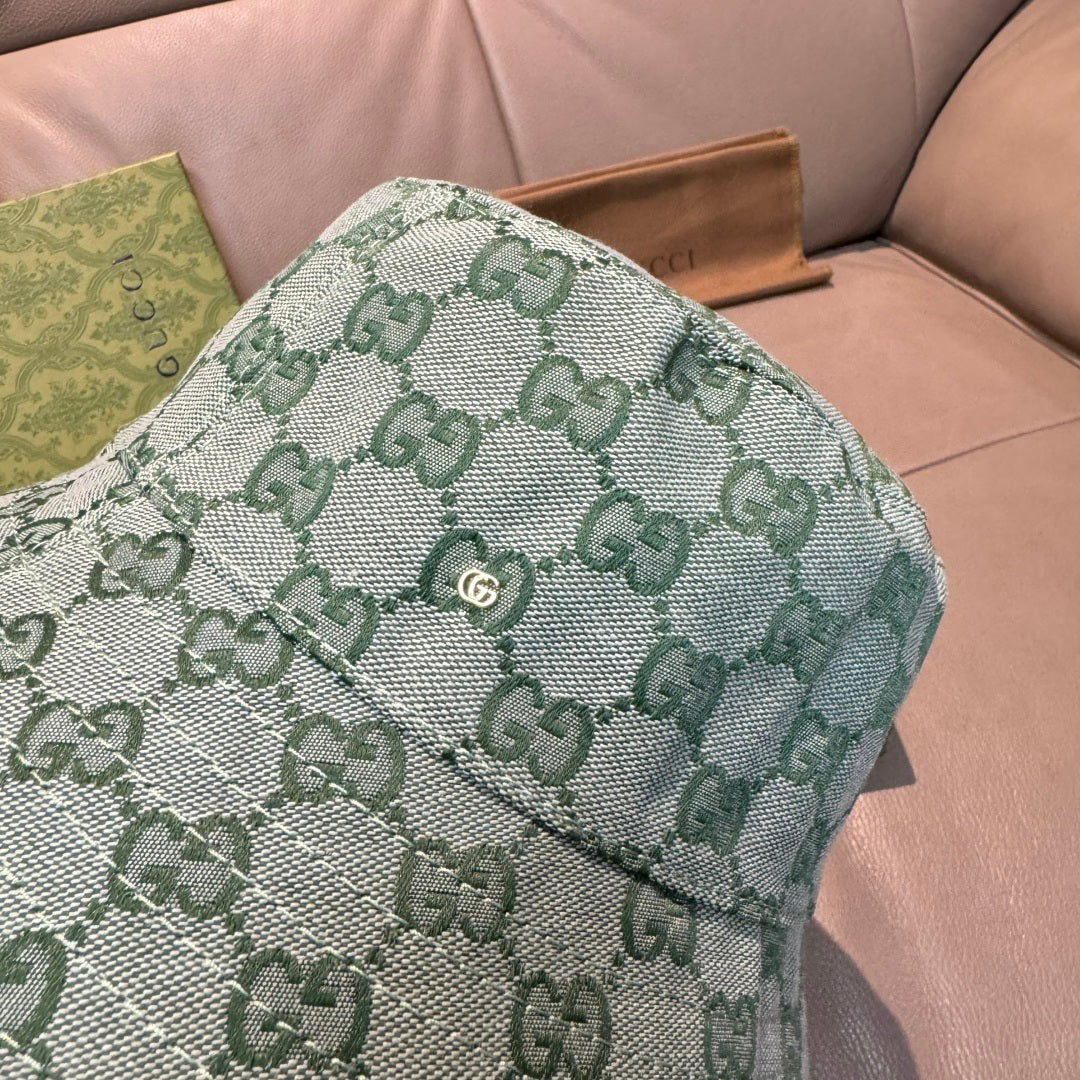 Green GG monogram bucket hat close-up of textured fabric and stitching