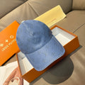Louis Vuitton monogram baseball cap in light blue with curved brim and stitched crown
