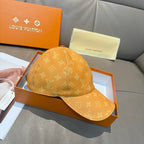 Louis Vuitton monogram baseball cap in tan/orange with curved brim and top seam