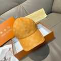 Louis Vuitton monogram baseball cap in tan/orange with curved brim