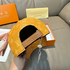 Louis Vuitton monogram cap with adjustable strap and black interior opening