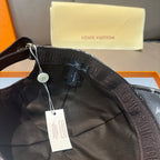 Monogram canvas cap interior label, dark lining with Louis Vuitton branding patch