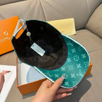 Louis Vuitton green monogram cap with black interior and attached tag