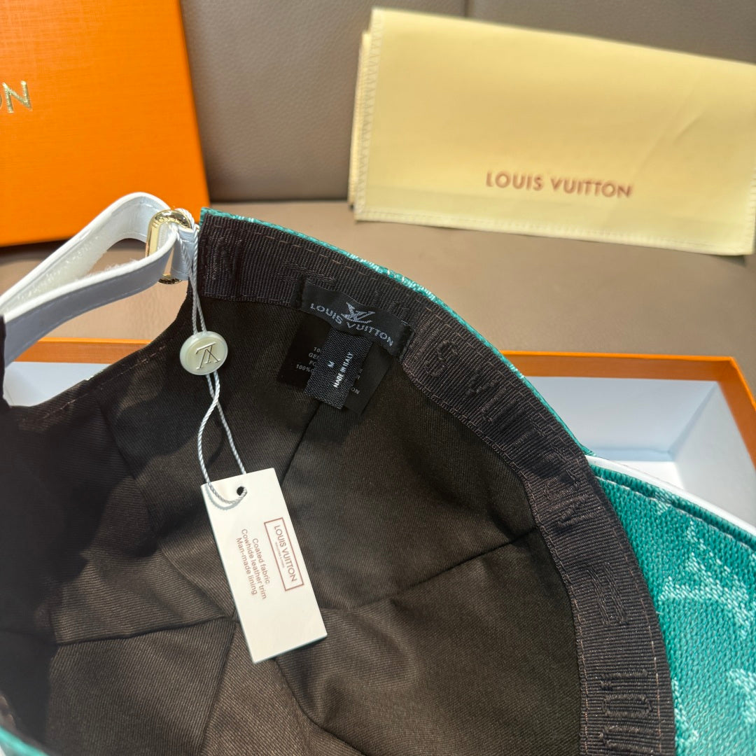Louis Vuitton green monogram cap with adjustable strap and hanging tags