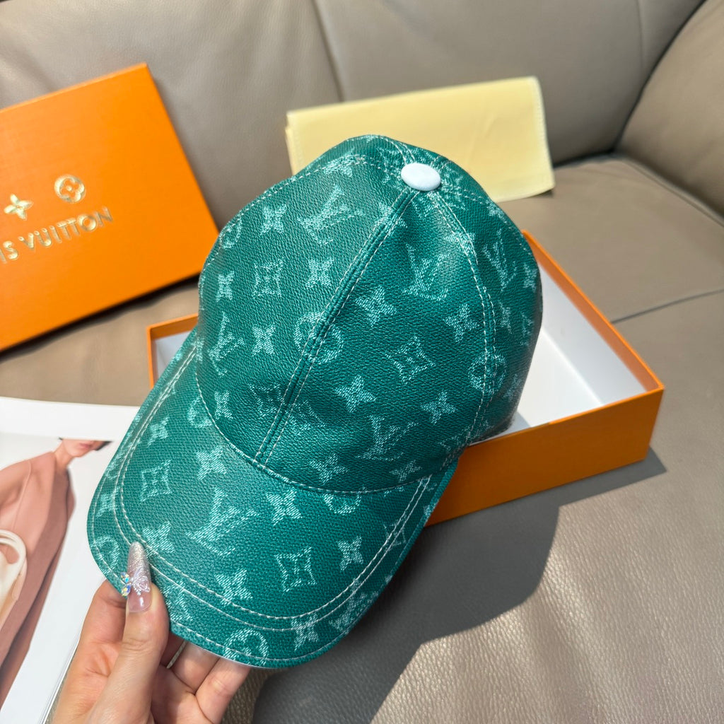 Louis Vuitton green monogram baseball cap with stitched seams and curved brim
