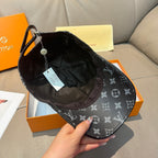 Monogram canvas cap interior, dark lining with adjustable strap and hanging tag