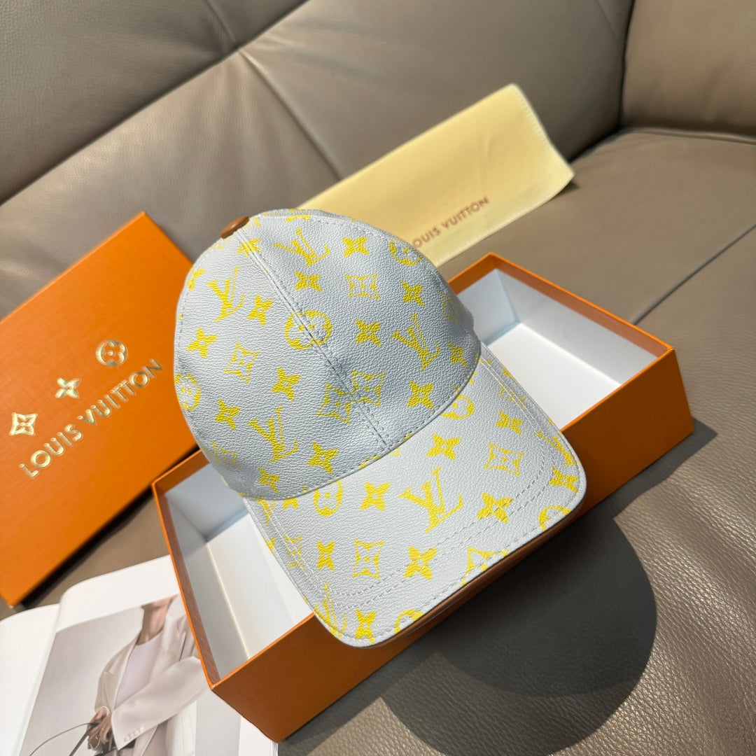 Louis Vuitton baseball cap in light blue with yellow monogram pattern and curved brim