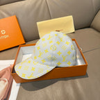 Louis Vuitton baseball cap, light blue with yellow monogram all-over print and curved brim