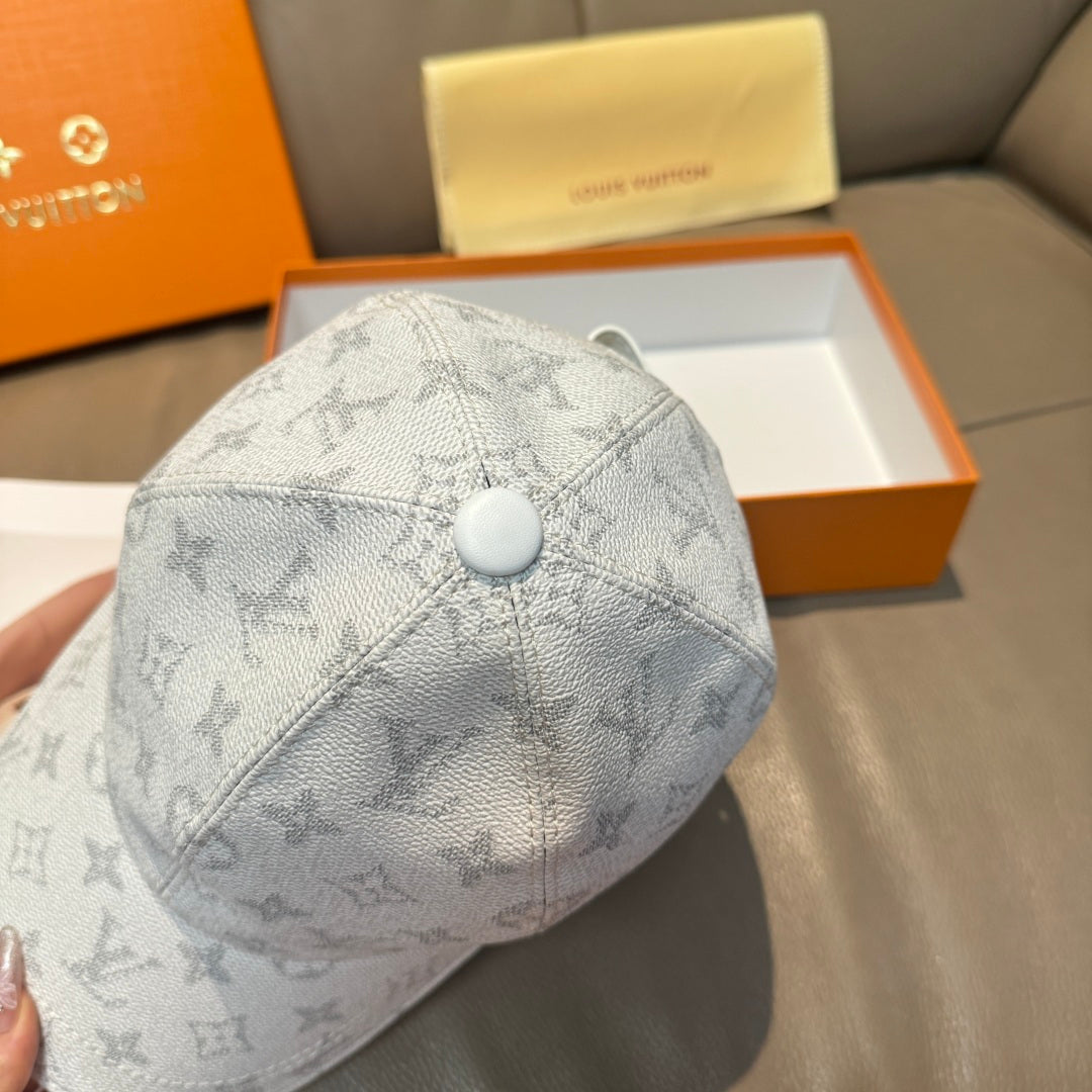 Louis Vuitton monogram baseball cap, light gray with round button crown and stitched panels.