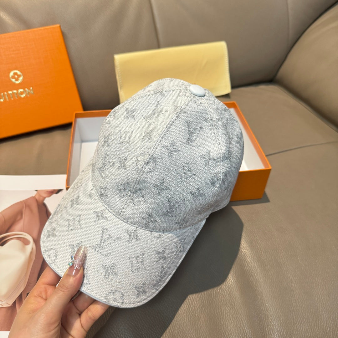 Louis Vuitton monogram baseball cap, light gray with round button crown and curved brim.