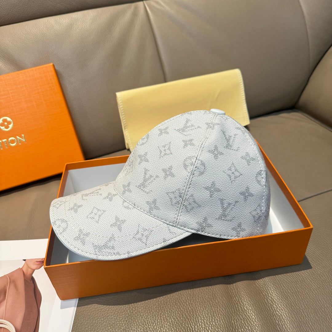 Louis Vuitton monogram baseball cap, light gray with curved brim and stitched seams.
