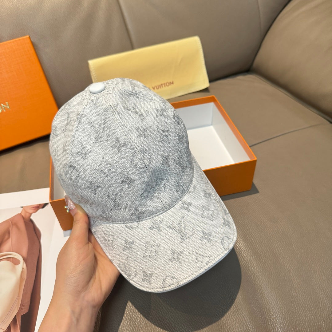 Louis Vuitton monogram baseball cap, light gray with top button and curved brim.