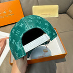 Louis Vuitton green monogram cap with white embroidered strap patch