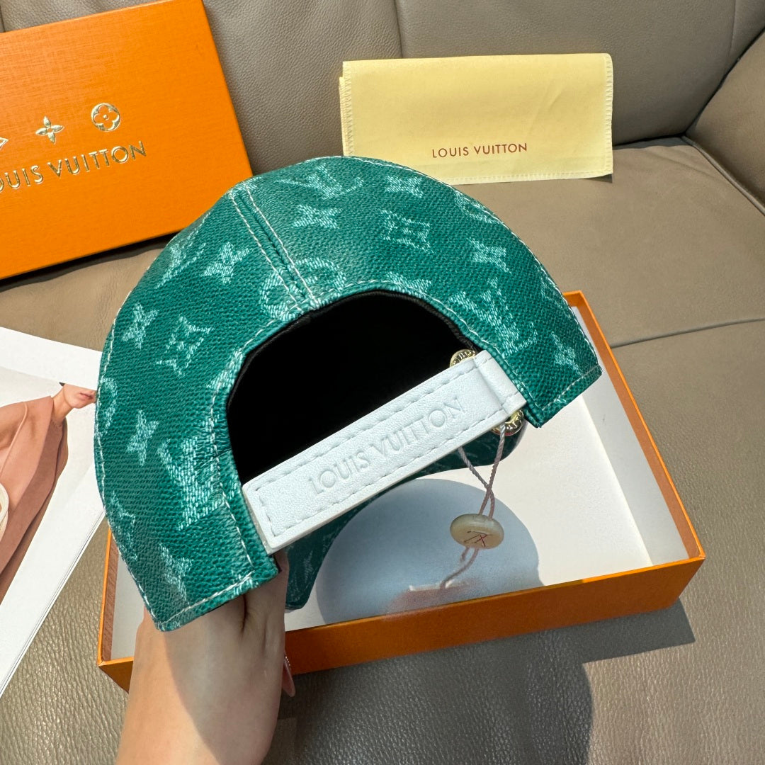 Louis Vuitton green monogram cap with white embroidered strap patch