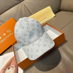 Louis Vuitton monogram baseball cap, light gray canvas with tone-on-tone logos.