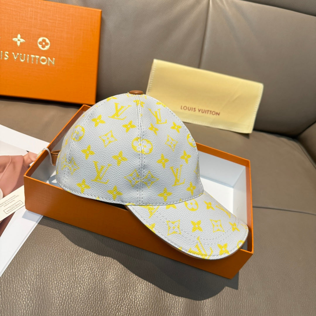 Louis Vuitton baseball cap in light blue with yellow monogram pattern and front seam detail