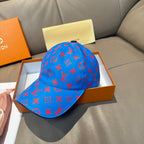 Louis Vuitton cap, bright blue with red monogram print and curved brim